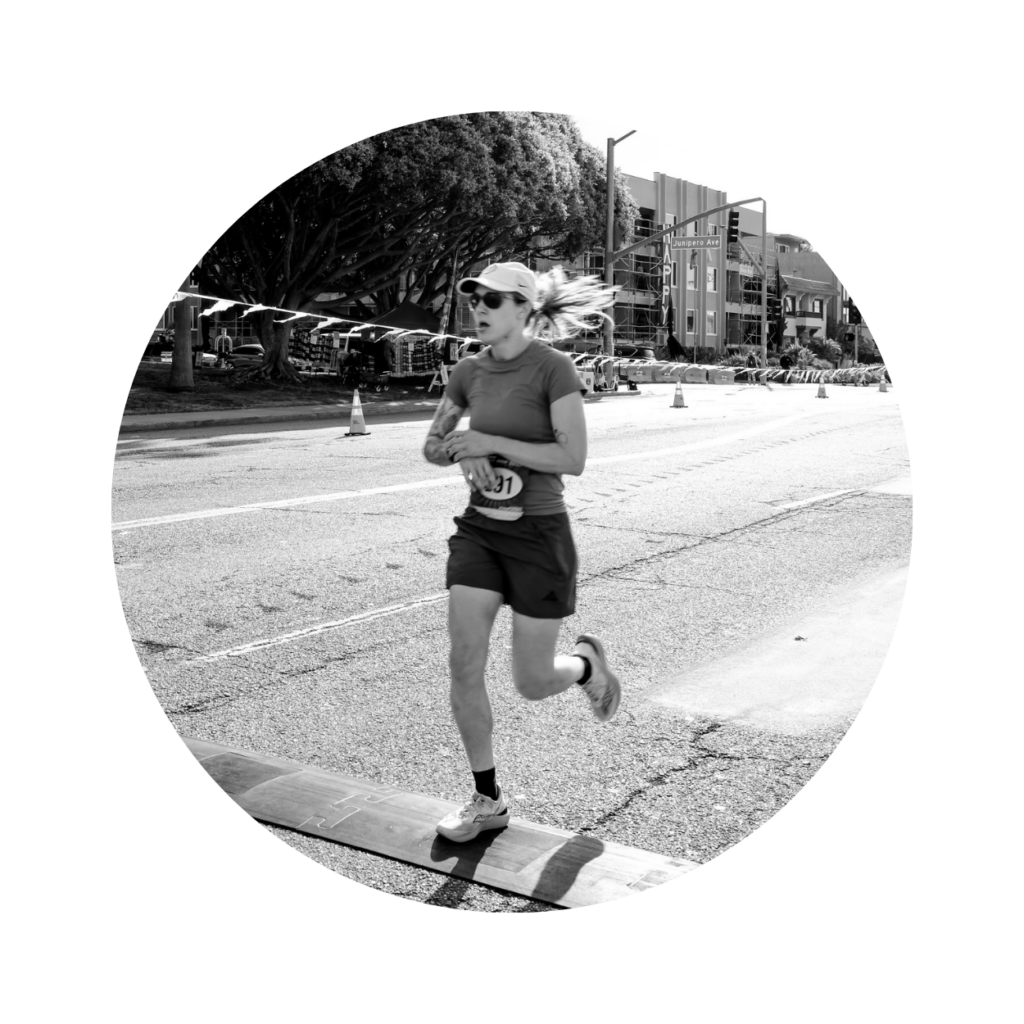 Fitness Product Reviewer Hannah H. crossing race finish line
