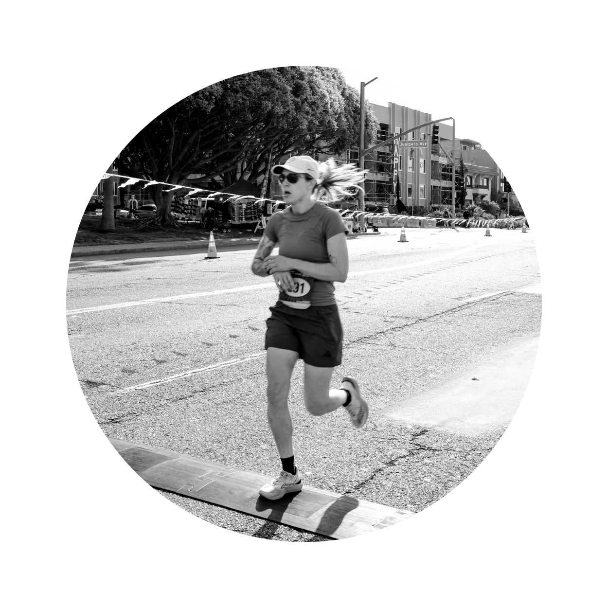 Our Three Cents sports product reviewer Hannah H. crossing a race finish line