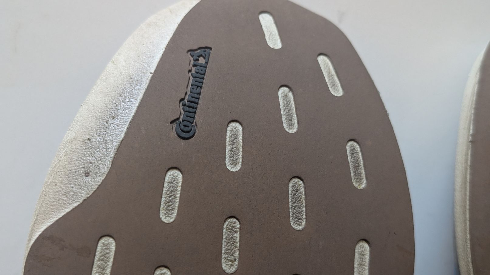 Close up of the brown Continental Tire rubber outsole on the bottom of the Adidas Adizero EVO shoe