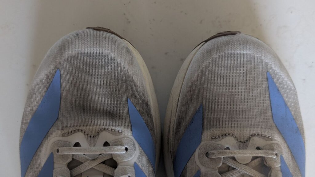 Close up of used Adidas Adizero EVO SL running shoes mesh upper
