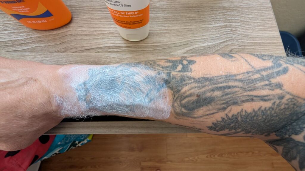 La Roche-Posay Mineral Sunscreen applied to sunflower tattoo on arm, leaving a white cast.