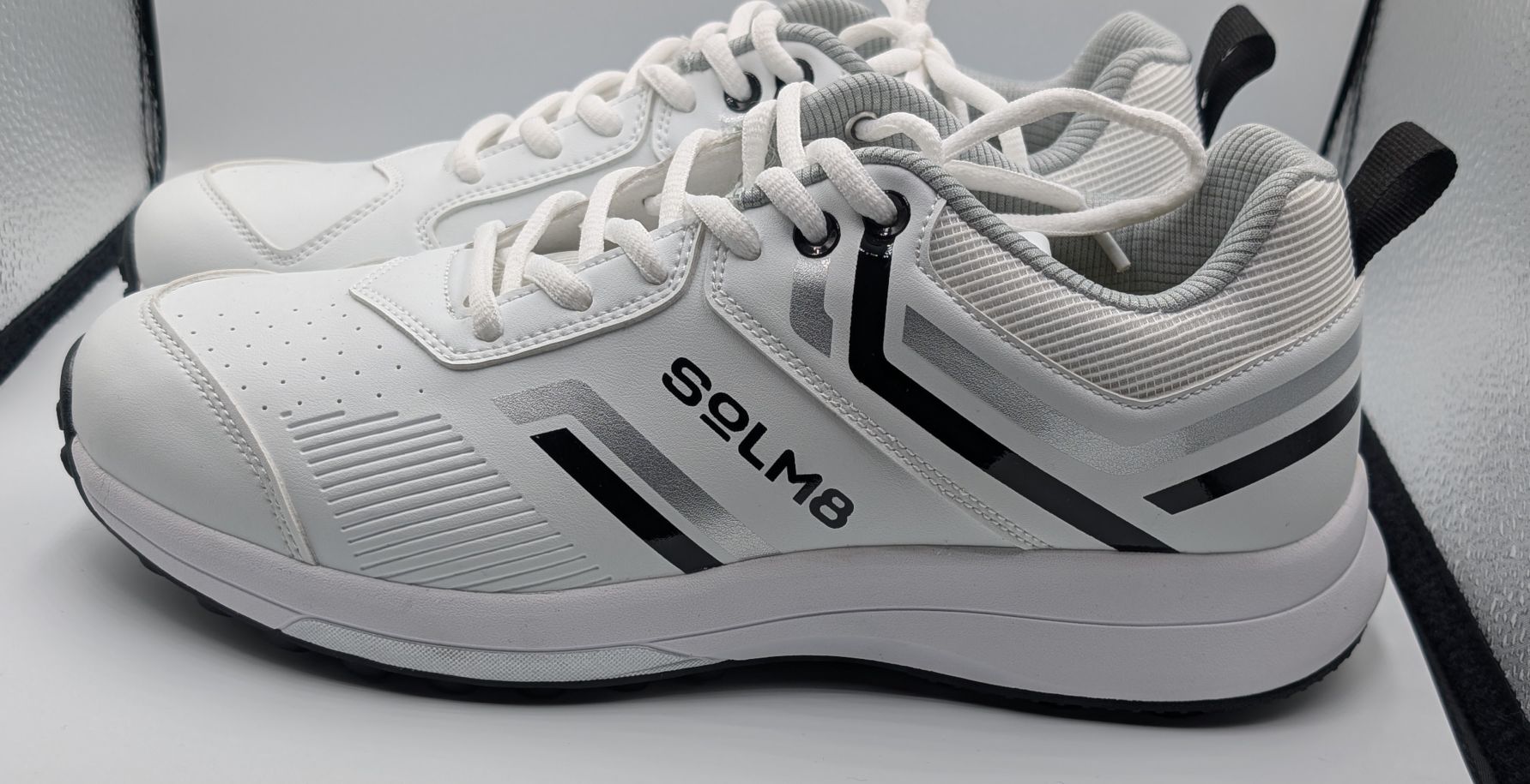 Side view of SOLM8 S1 rubber spikes in black and white style