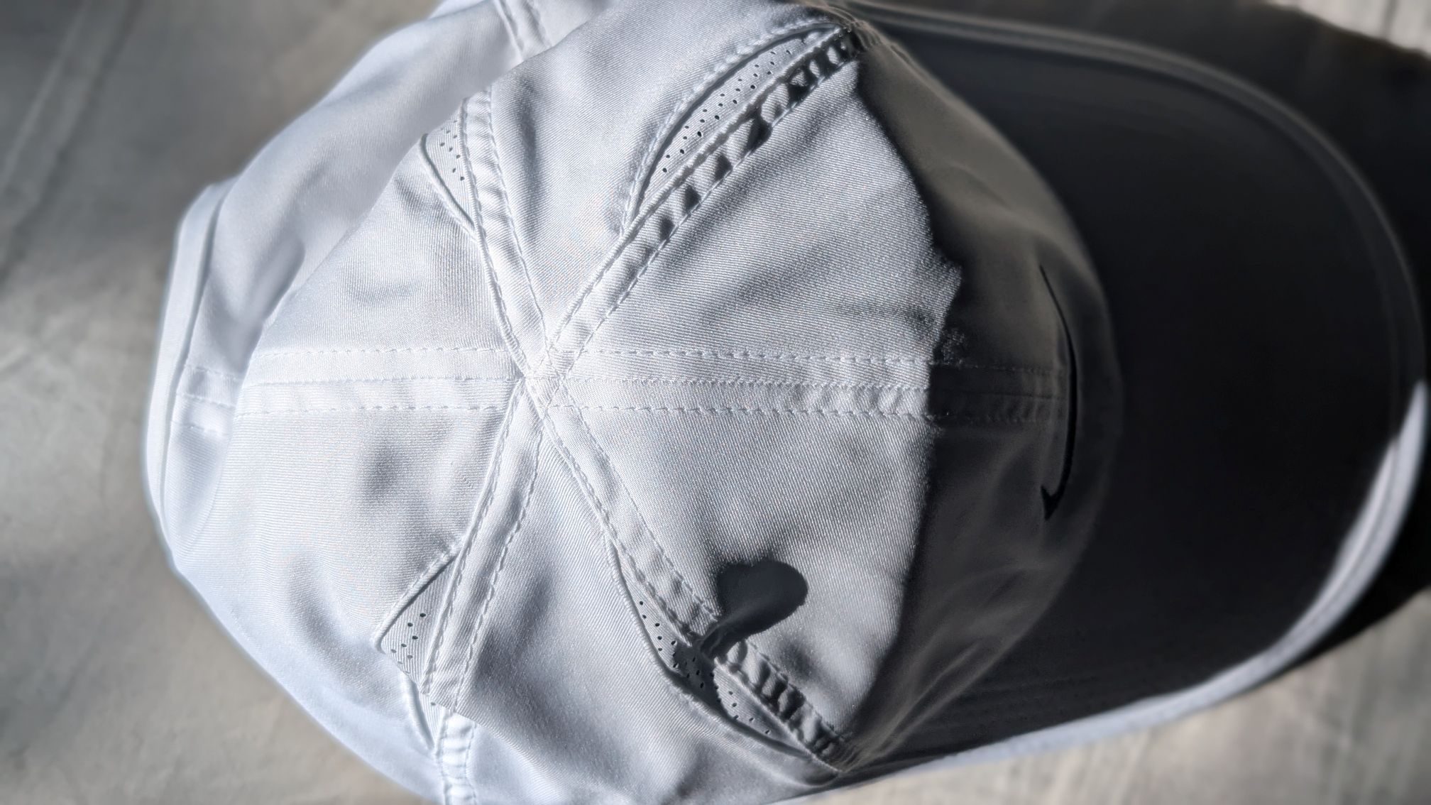 Top of white Nike Dri-FIT Club Unstructured Featherlight Cap for runners