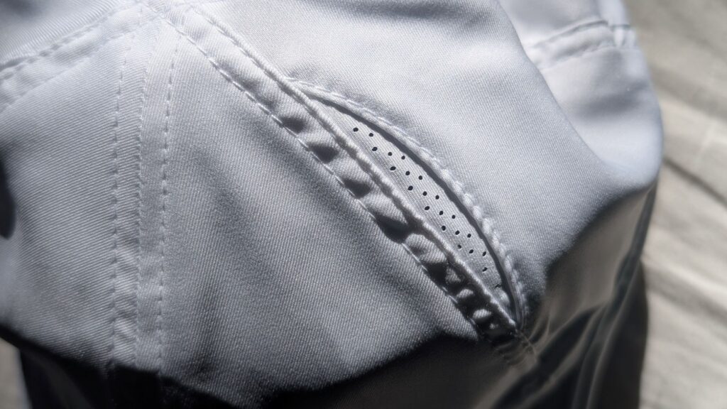 Close up of Nike Featherlight Vents on on white running cap