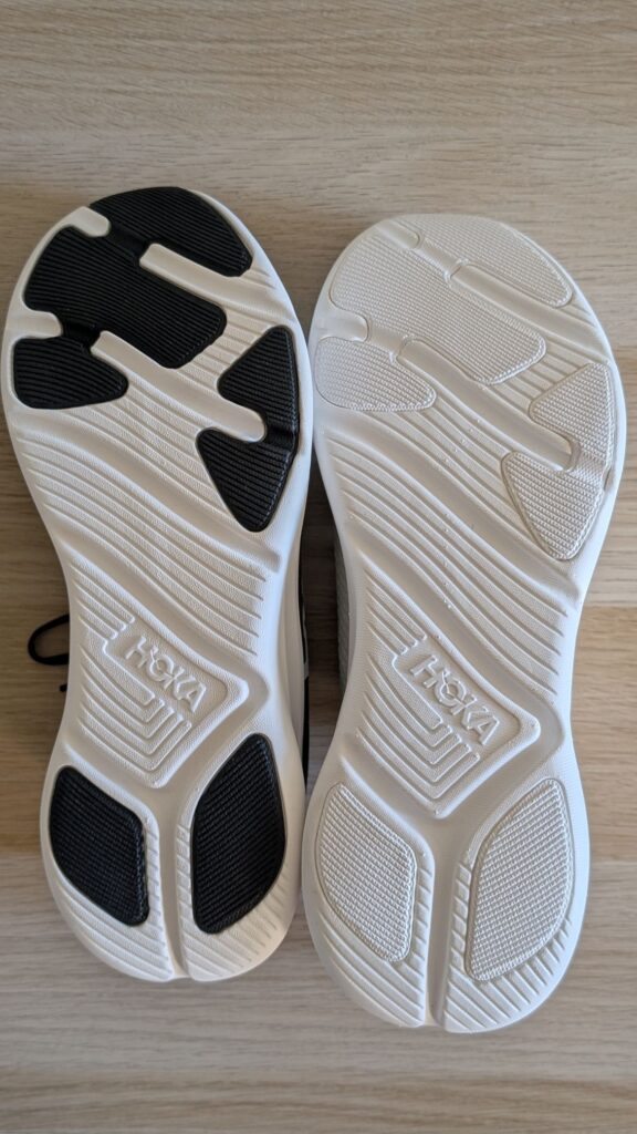 Upside down shoes showing Hoka Solimar 2 vs 1 rubber outsoles