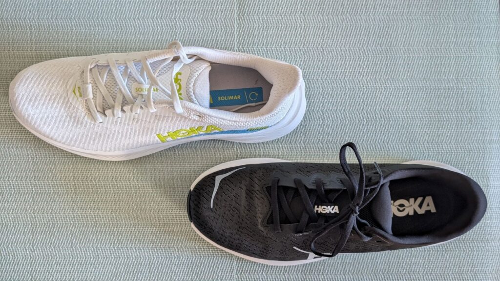 Top-down view of black and white Hoka daily trainers