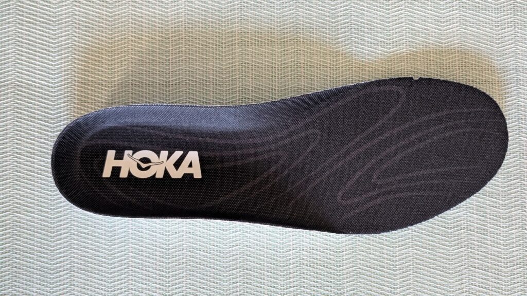 Hoka Solimar 2 insole in black with logo and silver swirls