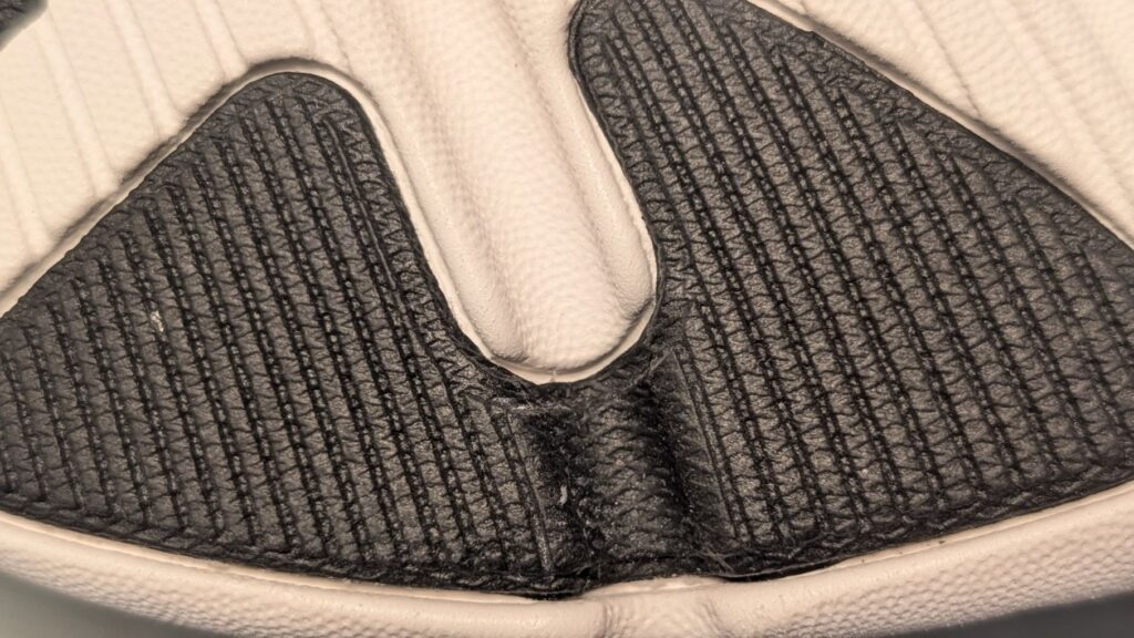 Detailed view of off-center shoe rubber