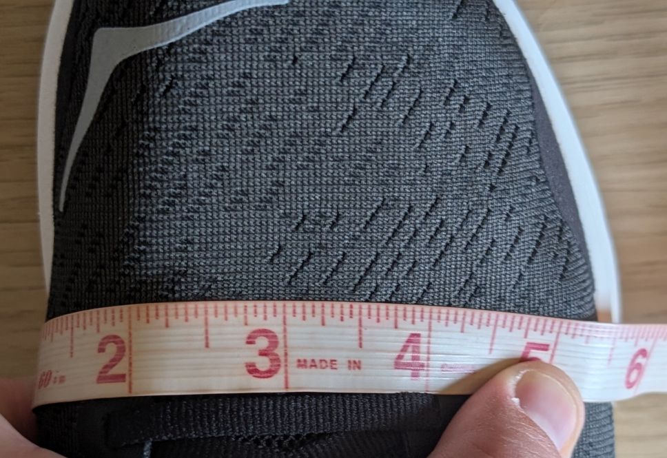 Measuring tape showing 6 inches width on Hoka Solimar 2 running shoe