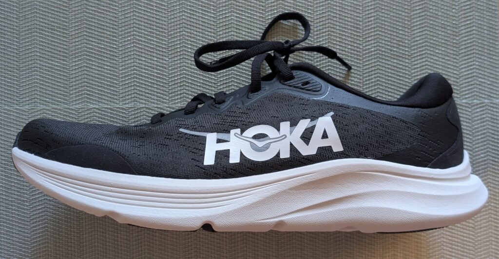 Profile view of Hoka Solimar 2 running shoe in black and white