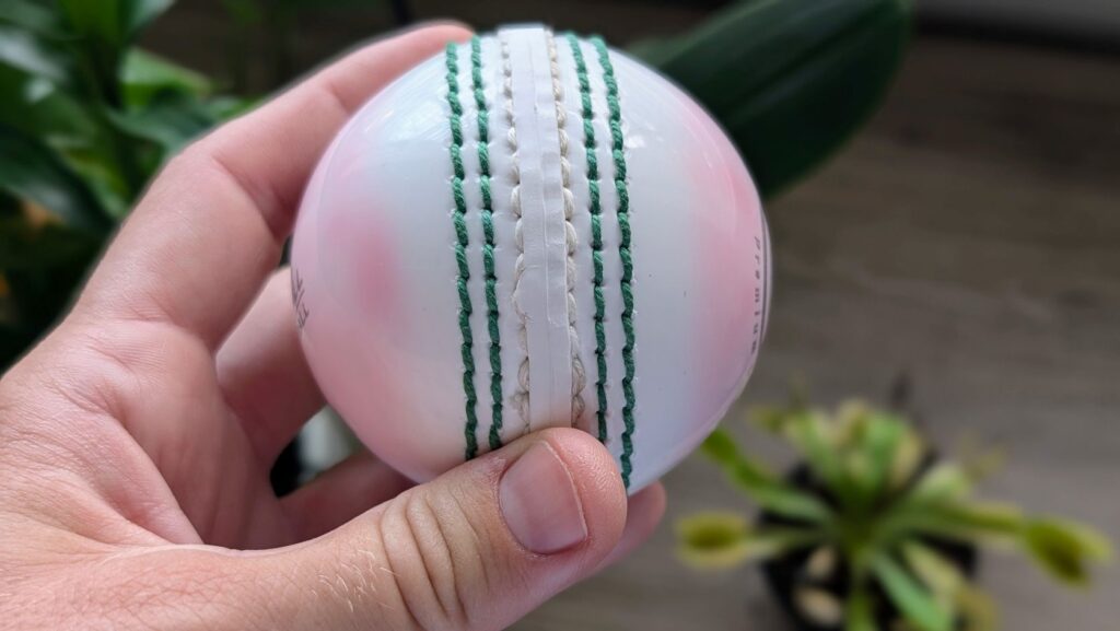 Close up of stitching on Amazon synthetic cricket ball