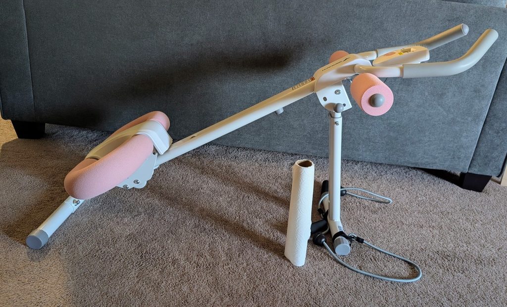 MERACH Ab machine size behind sofa with paper towel for height reference