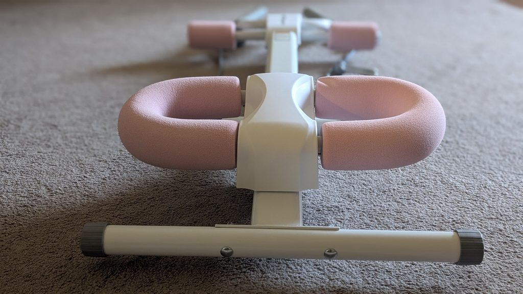 Close up of MERACH Ab Machine foam knee pads in pink and white